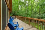 Wrap around deck to private, wooded backyard with babbling brook